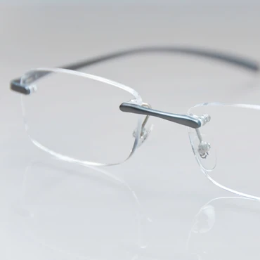a close up shot of rimless glasses